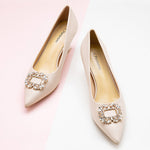 Embellished Buckle Kitten Heel Pumps in White, providing a clean and contemporary touch to your ensemble.