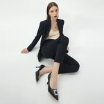 Embrace classic and versatile style with these black leather pumps, featuring a sparkling crystal buckle detail for a timeless look