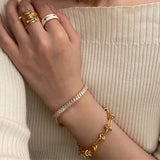 Molten Baroque Pearl Twisted Chain Bracelet, sculpted to perfection with gold details, this bracelet exudes opulence and sophistication, making it a statement piece for any occasion