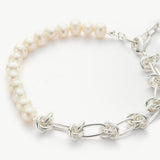 Molten Baroque Pearl Twisted Chain Bracelet, sculpted to perfection with platinum details, this bracelet exudes opulence and sophistication, making it a statement piece for any occasion.