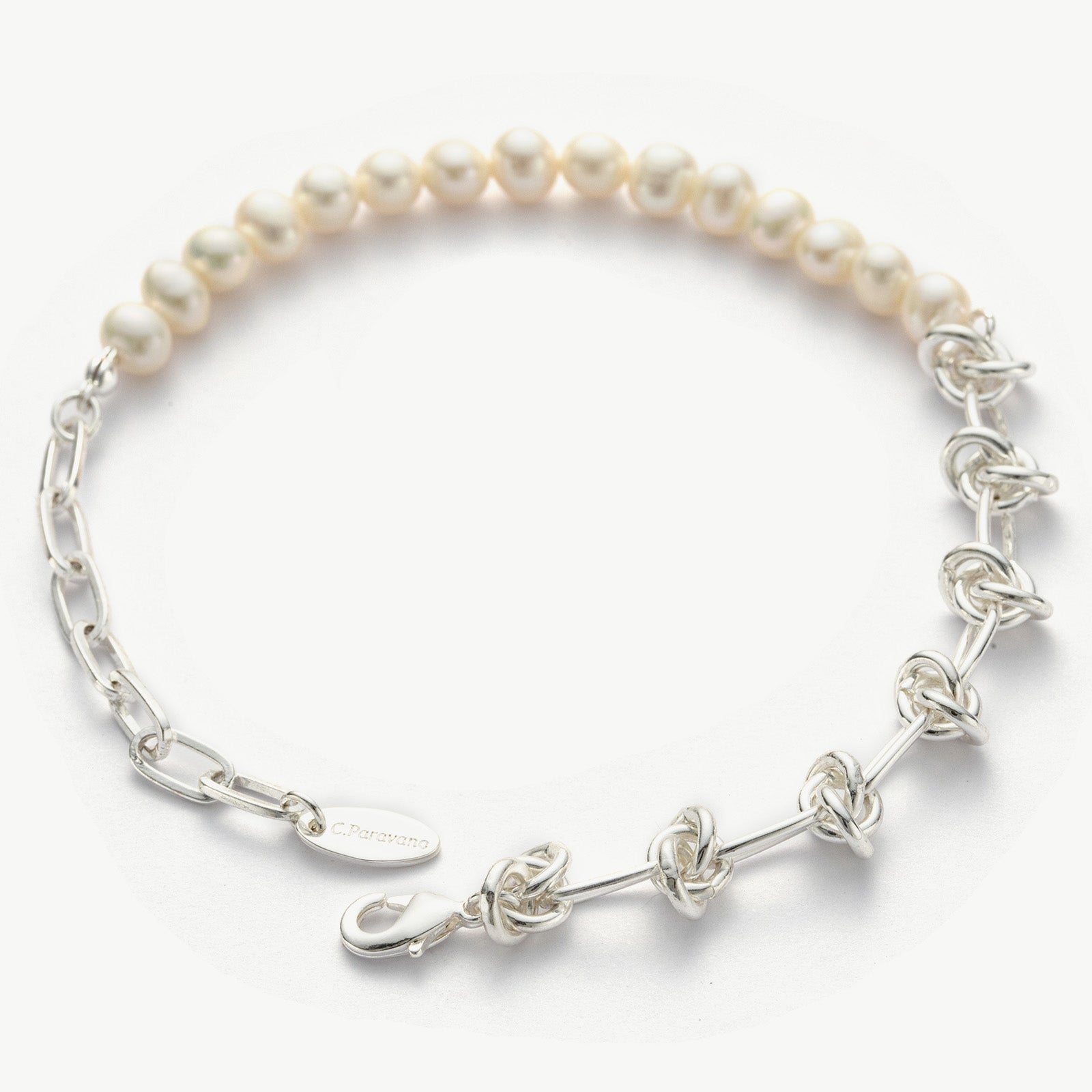 Molten Baroque Pearl Twisted Chain Bracelet featuring a twisted chain design in platinum, this bracelet radiates with the lustrous glow of baroque pearls, adding a touch of radiant beauty to your wrist
