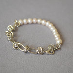 Molten Baroque Pearl Twisted Chain Bracelet, a fusion of modern design and classic pearls in platinum, this bracelet brings a contemporary twist to traditional elegance, making it a versatile and chic accessory