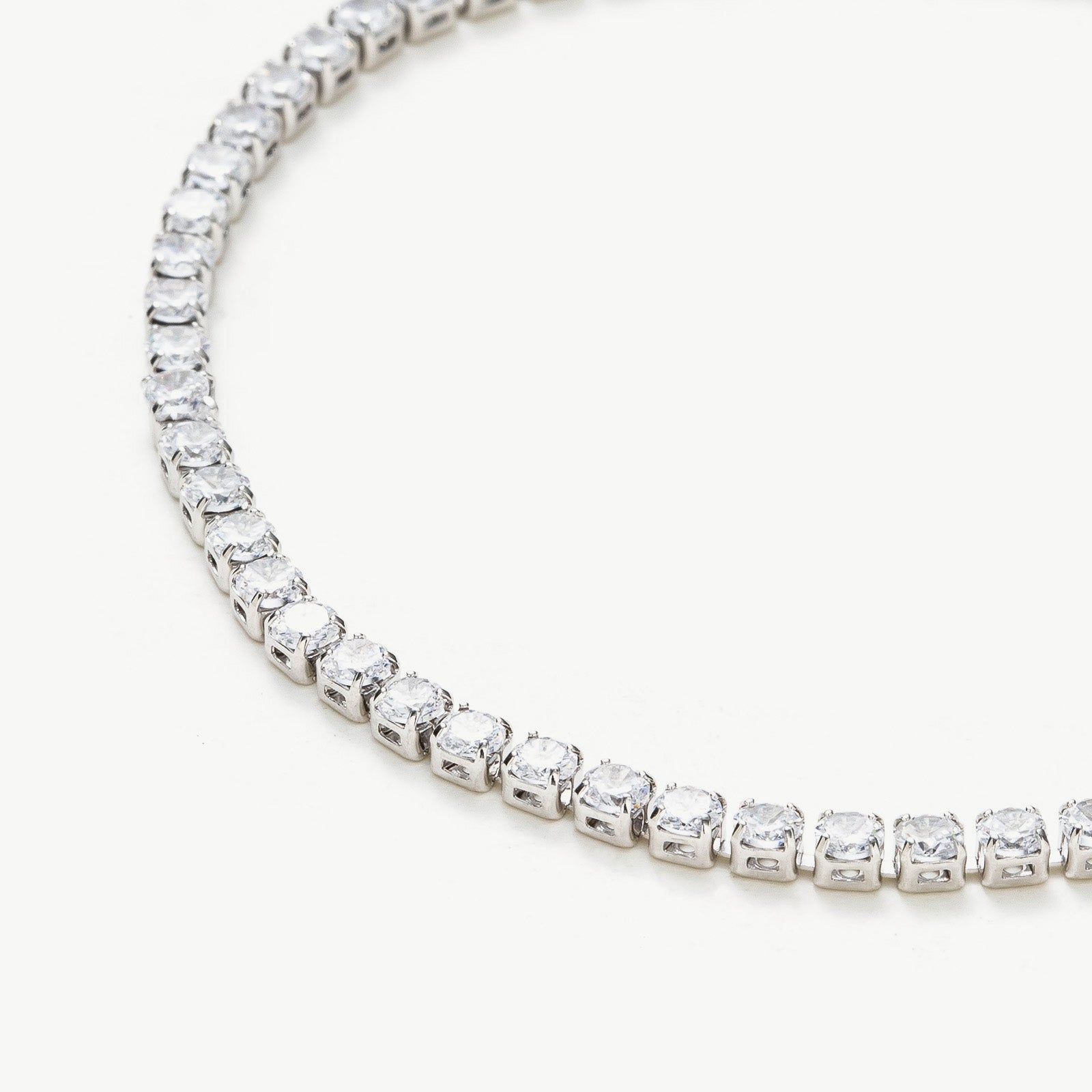  Crystal Twinkle Bracelet, crafted with a strand of sparkling crystals in a platinum hue, this bracelet adds a touch of glamour and sophistication to your wrist, making it an exquisite accessory for formal events