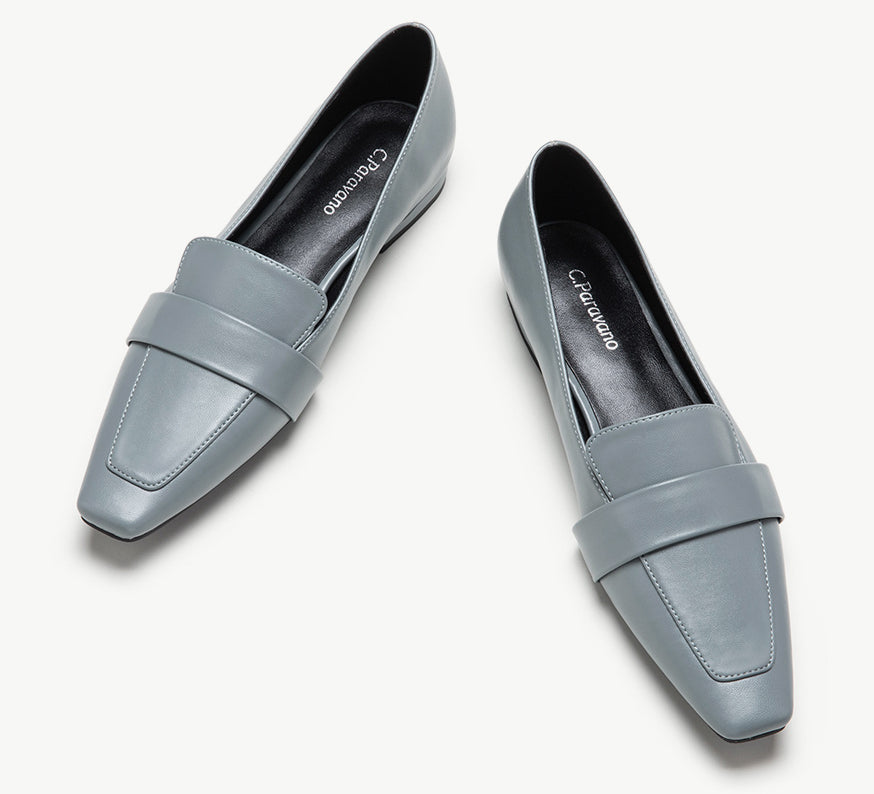 Blue platform loafers with penny strap detail.