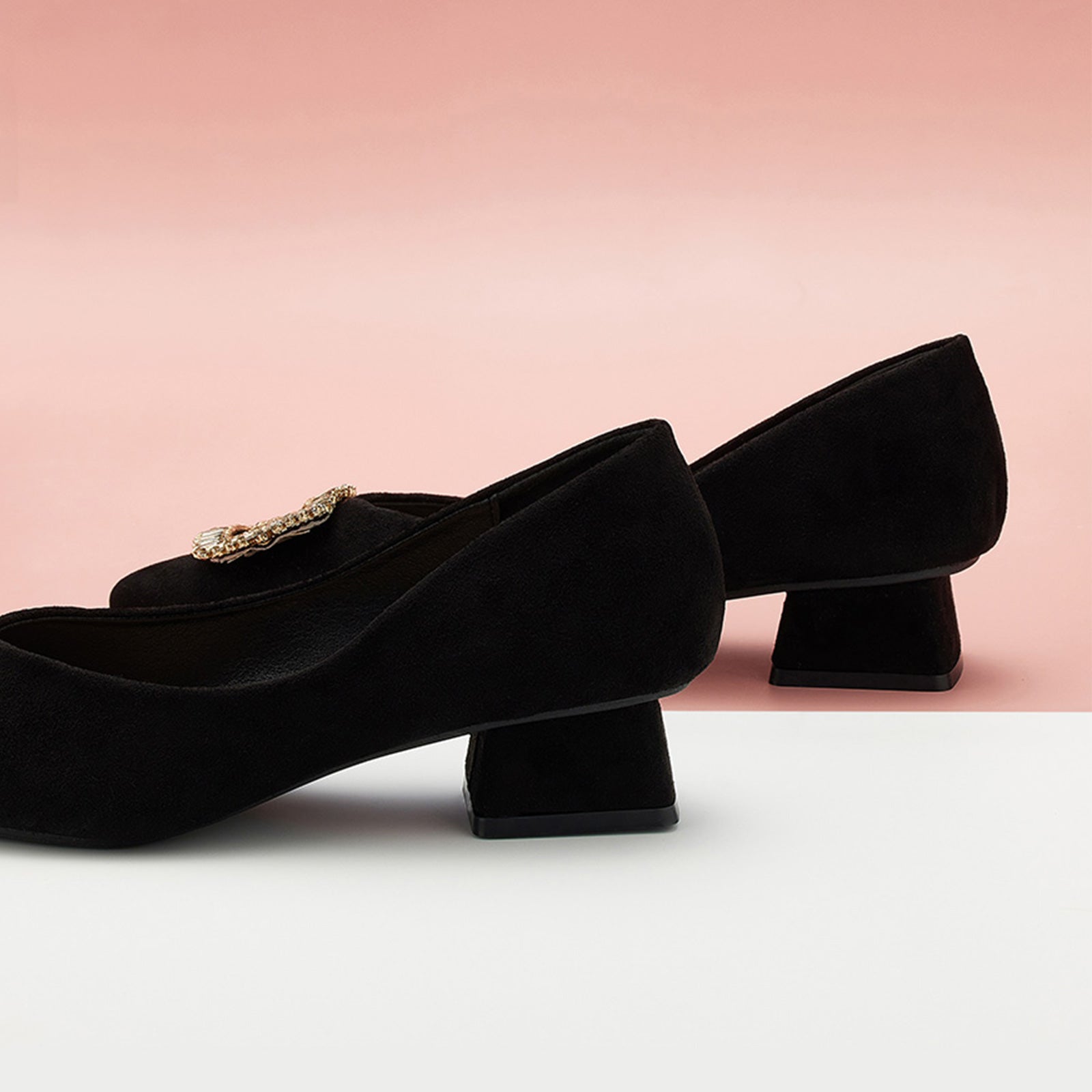 Black Suede Pumps adorned with embellishments, a must-have for a polished wardrobe