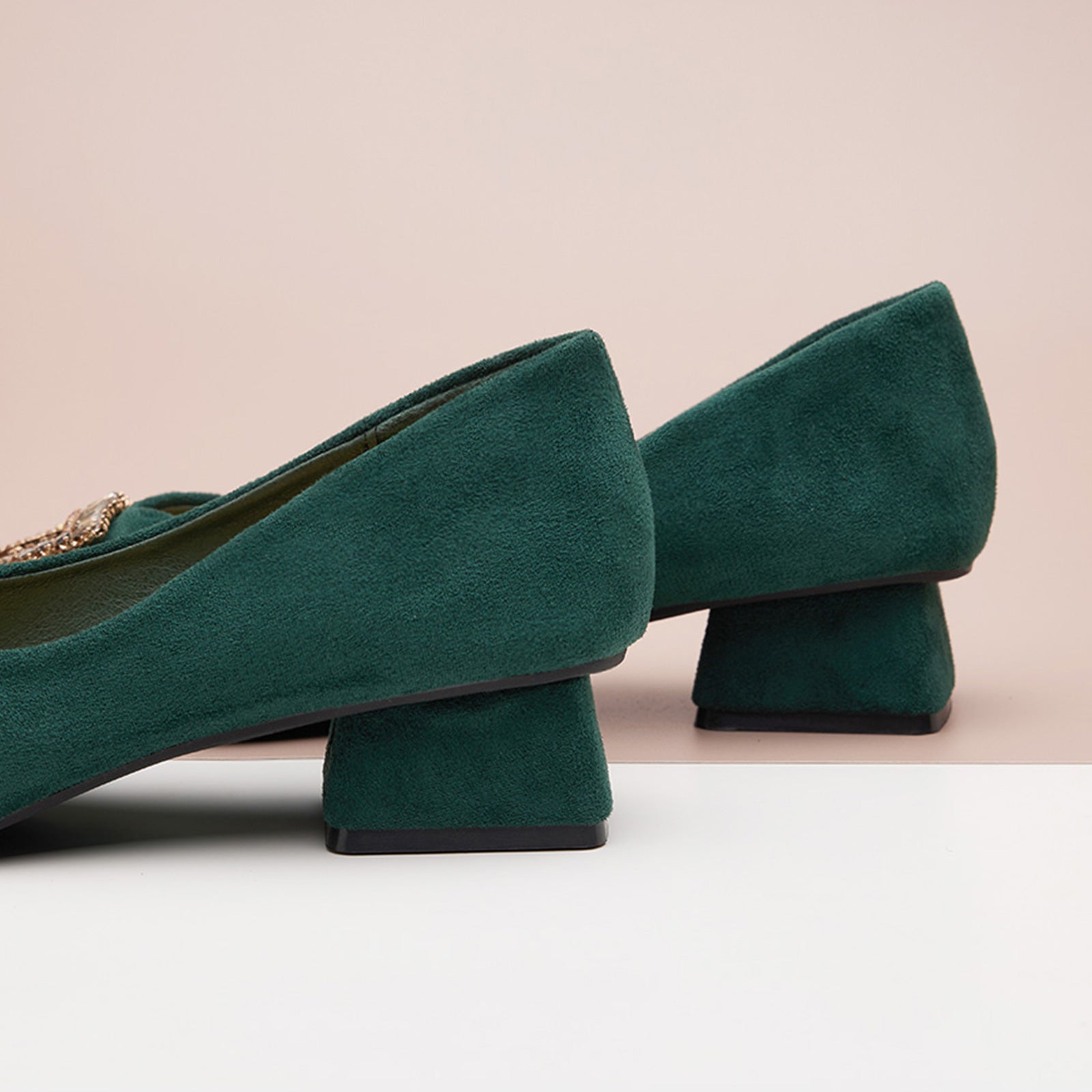 Green Suede Pumps adorned with embellishments, a fresh and stylish choice