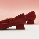 Red Suede Pumps with embellishments, perfect for making a bold fashion statement