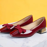 Red Patent Leather Block Heel Pumps, a confident and eye-catching addition to your footwear collection