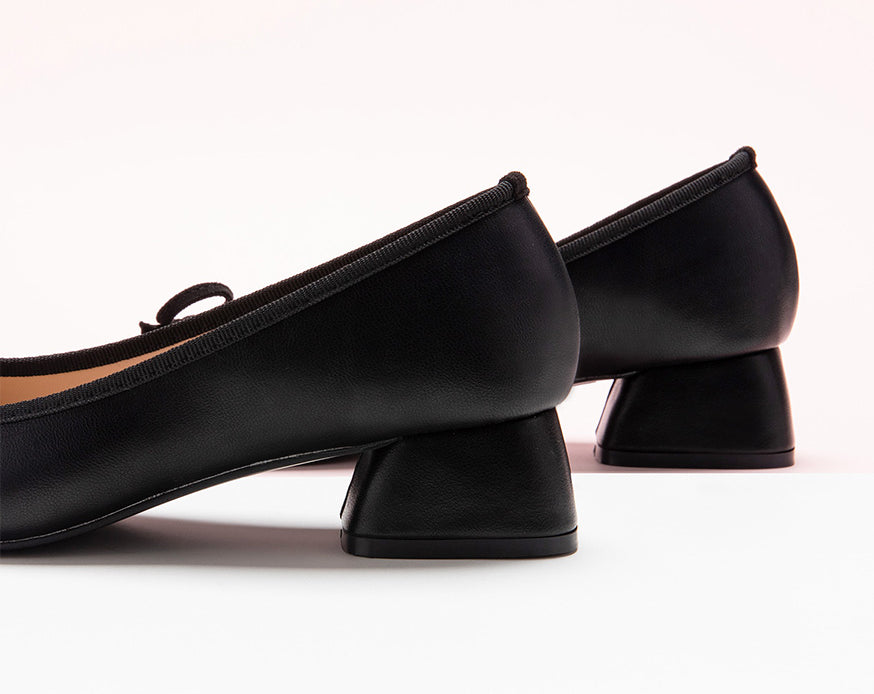 Step Into Style with Bowknot Adorned Black Low Heels - Make a statement with these fashionable low heels that effortlessly combine sophistication and trendiness