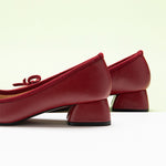 Chic Red Heels adorned with a Fashionable Bowknot