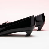 Metal Buckle Low Heels in Black, a timeless and versatile option for everyday elegance.