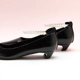 Sophisticated Black Heels adorned with Pearl Straps