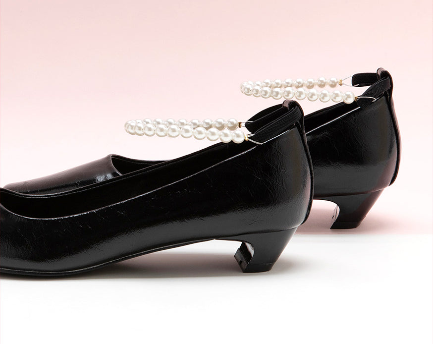 Sophisticated Black Heels adorned with Pearl Straps