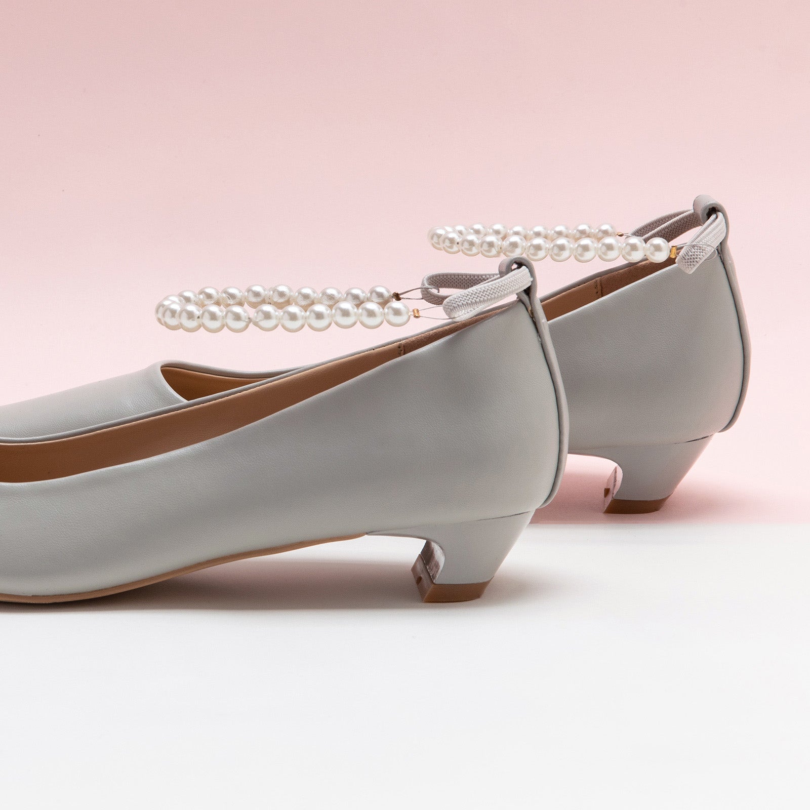 Pearl Straps Low Heel in Grey, adding a touch of modernity and style to your everyday look