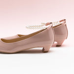 Pink Pearl Straps Low Heel, offering a trendy and fashionable touch to your ensemble.