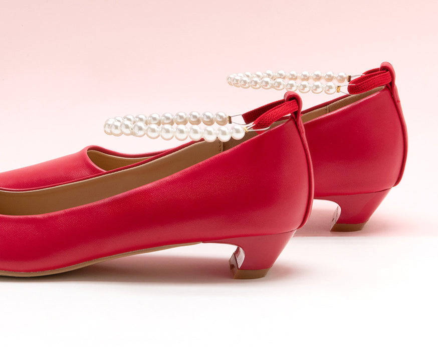 Sleek Red Heels adorned with Pearl Accents"