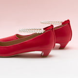 Pearl Straps Low Heel in Red, adding a touch of modernity to your ensemble in a striking color