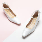 White Pearl Straps Low Heel, a clean and timeless choice for a sophisticated and versatile look.