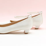 Chic White Heels adorned with Pearl Accents