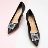Chic-black-leather-pumps-adorned-with-delicate-embellishments_-perfect-for-adding-a-touch-of-elegance-to-your-outfit