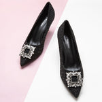 Chic-black-tweed-pumps-adorned-with-delicate-embellishments_-perfect-for-adding-a-touch-of-elegance-to-your-outfit
