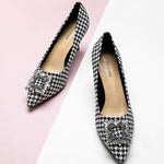 Elegant-houndstooth-pumps-crafted-from-tweed_-featuring-stunning-embellishments-for-a-refined-and-glamorous-loo
