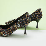 Chic-navy-blue-tweed-pumps-adorned-with-delicate-embellishments_-perfect-for-adding-a-touch-of-elegance-to-your-outfit-