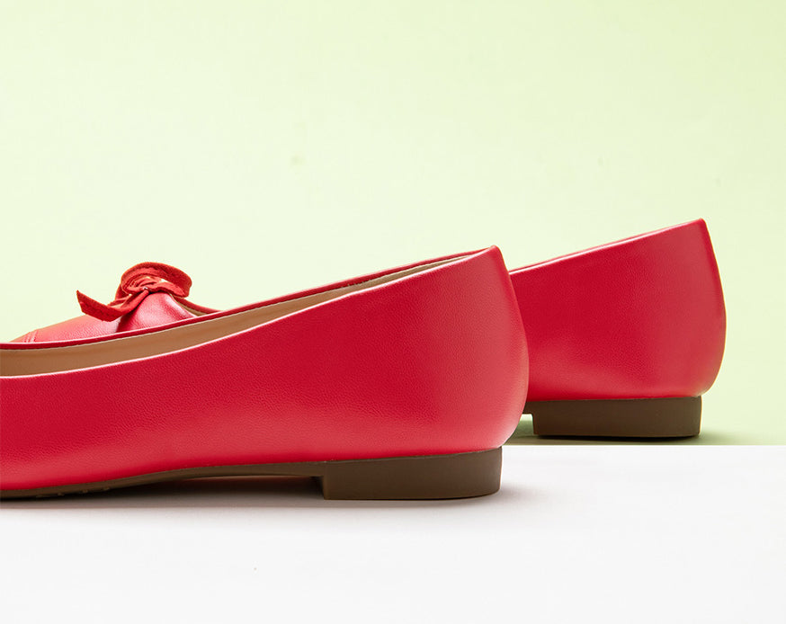 Chic-red-ballet-flats-with-a-delightful-bowknot-detail-and-a-soft-suede-toe.
