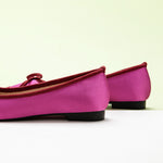 Chic-silky-hot-pink-ballet-flats-with-a-charming-bowknot-accent_-adding-a-pop-of-color.