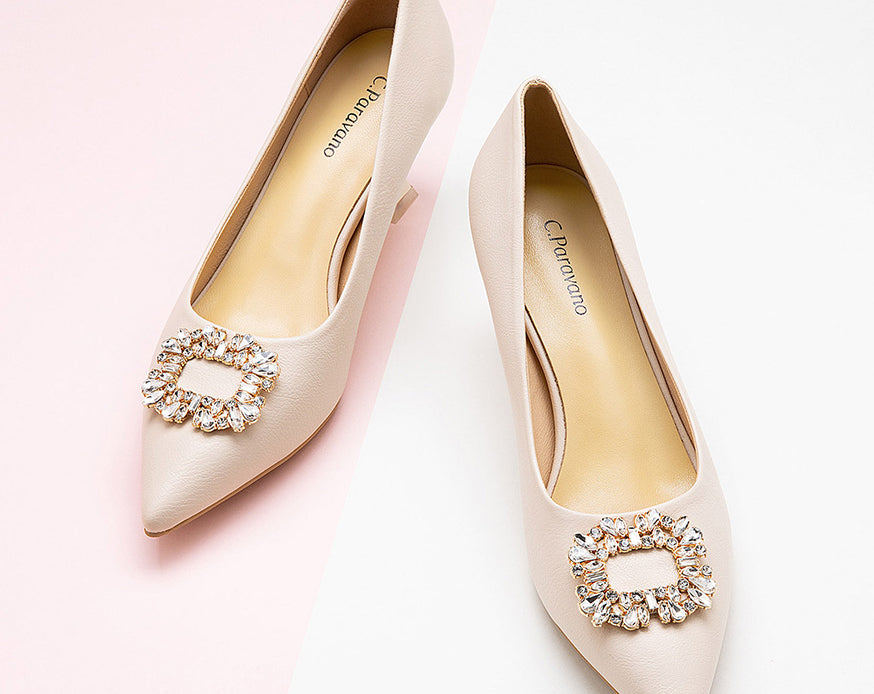 Chic-white-leather-pumps-adorned-with-intricate-embellishments_-perfect-for-a-polished-and-stylish-appearance