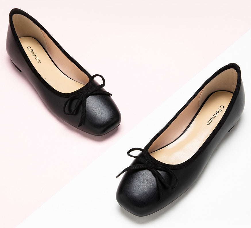 Classic-black-ballet-flats-adorned-with-a-stylish-and-dainty-bowknot