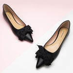     Classic-black-flats-with-a-sophisticated-pointy-toe-design-in-shiny-leather
