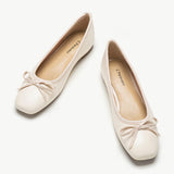 Classic-white-ballet-flats-with-an-elegant-bowknot-detail_-ideal-for-timeless-style.