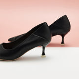  Black Convertible Pumps with a kitten heel, perfect for adding a touch of city glamour to your ensemble