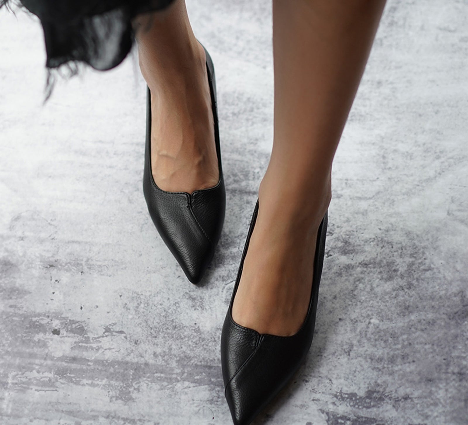  Black Convertible Pumps with a stylish kitten heel, a modern and fashionable option for city living