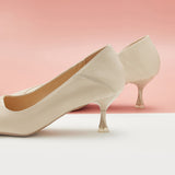  Kitten Heel Convertible Pumps in White, providing a clean and contemporary touch to your ensemble