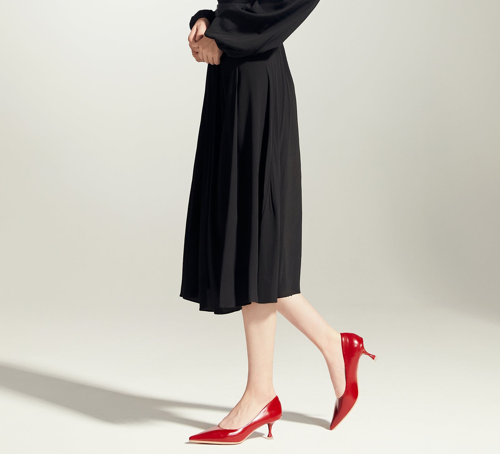 Bold and Beautiful: Red Glossed Patent Leather Pumps, adding a touch of modernity to your ensemble in a striking hue