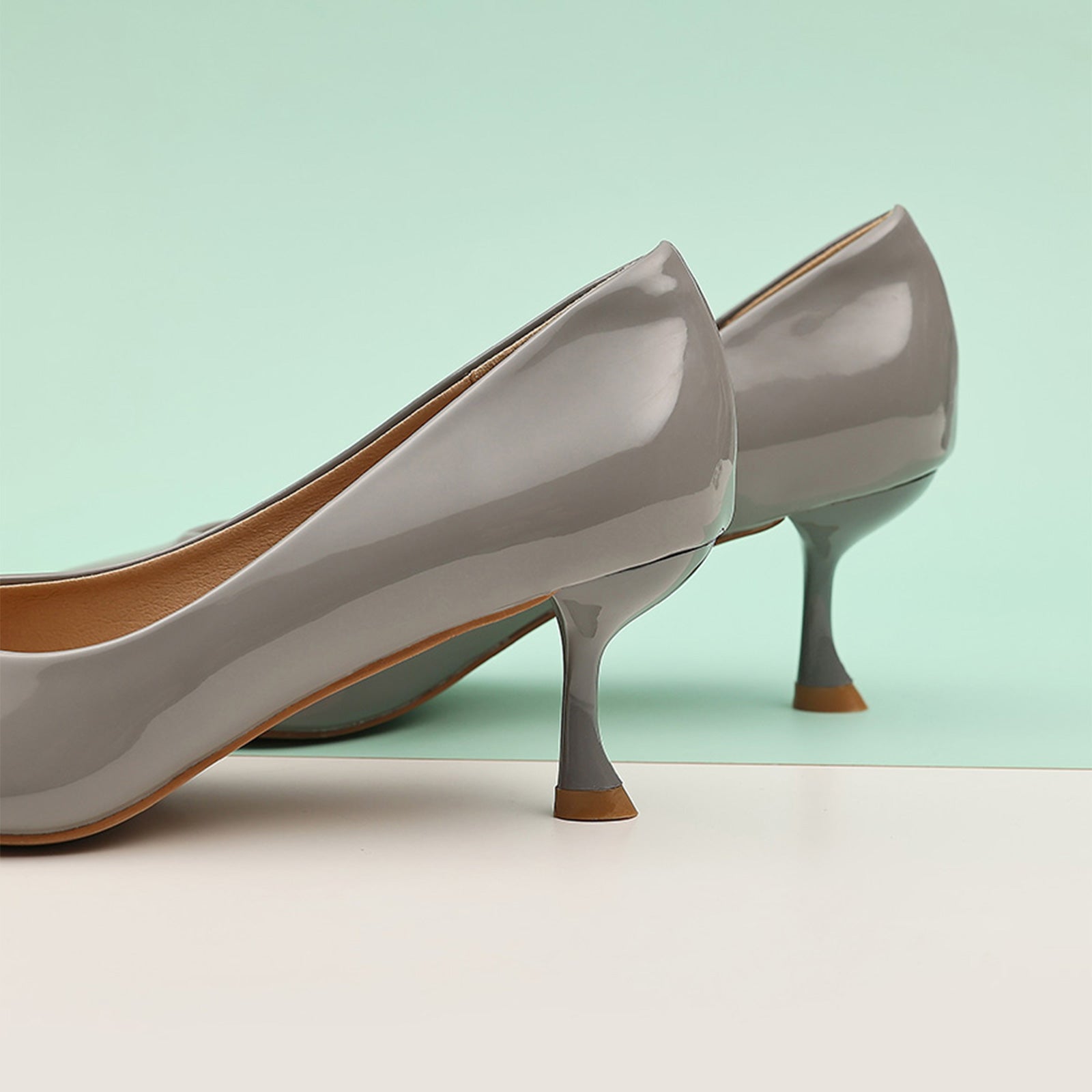 Grey Patent Leather Pumps with a glossy finish, a classic and refined option for any occasion
