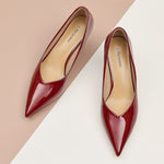Red Glossed Patent Leather Pumps, adding a touch of modernity to your ensemble in a striking hue