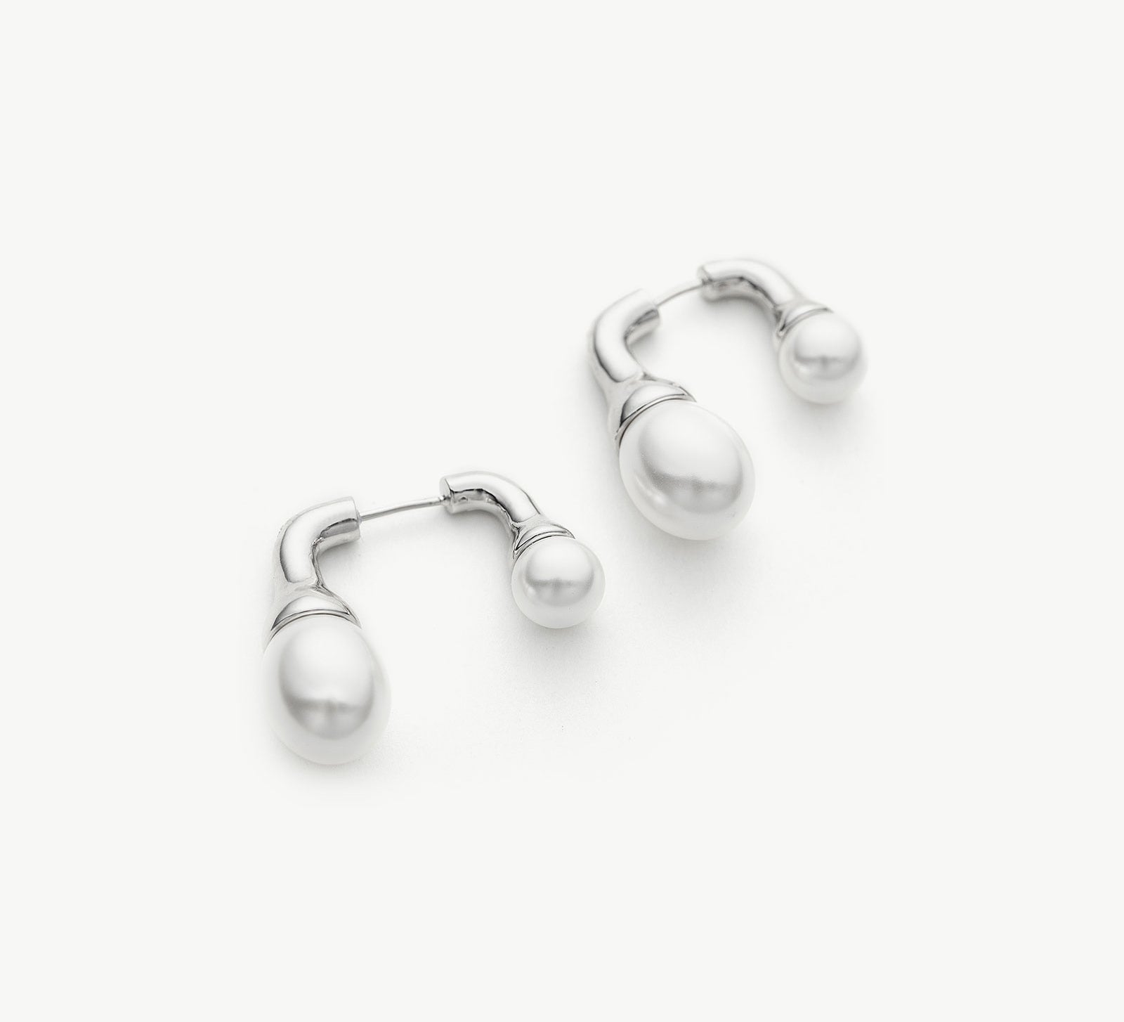 Silver Double Pearls Earrings, an effortlessly charming accessory that seamlessly complements your everyday or special occasion attire
