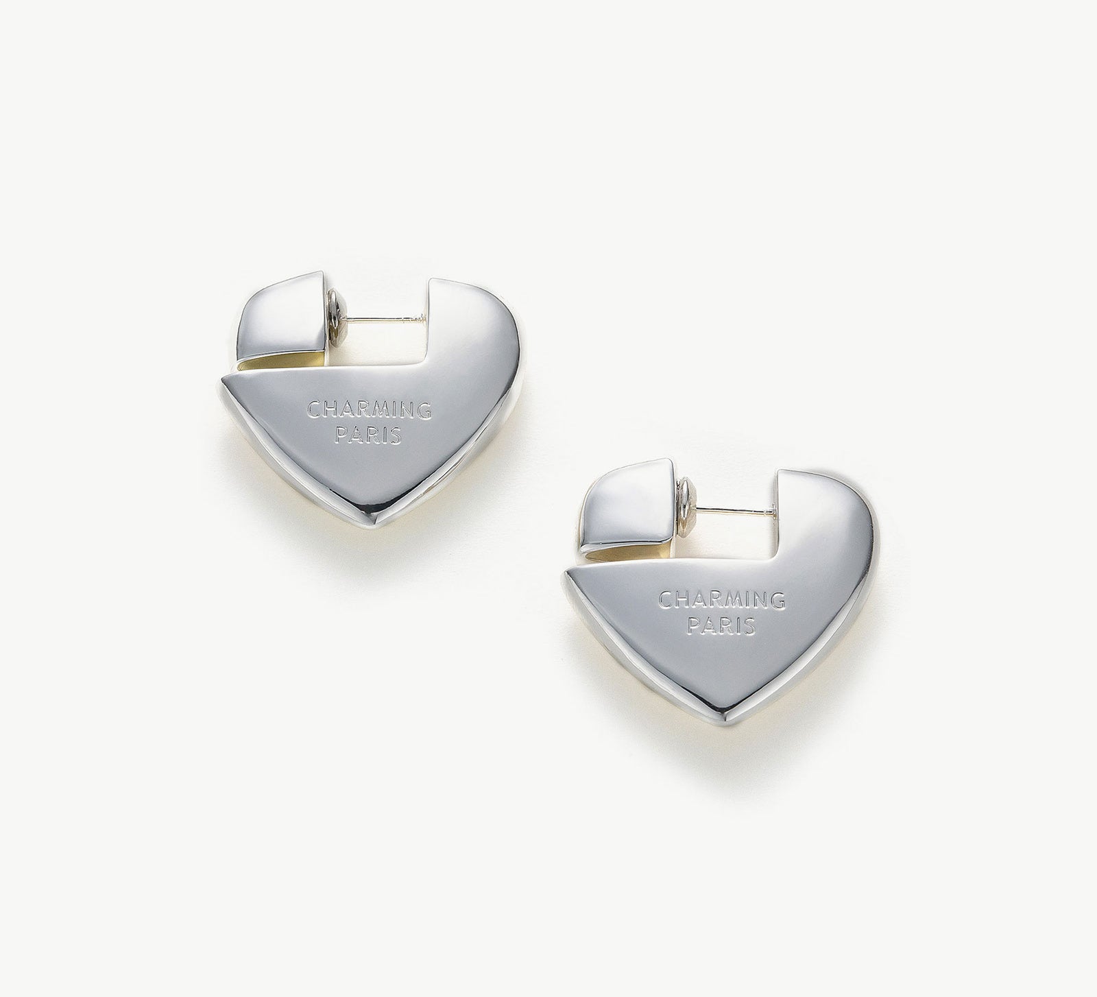 Heart Hoop Earrings in Silver, radiating with a silver sheen, these hoops bring a touch of modern elegance and romance to your style