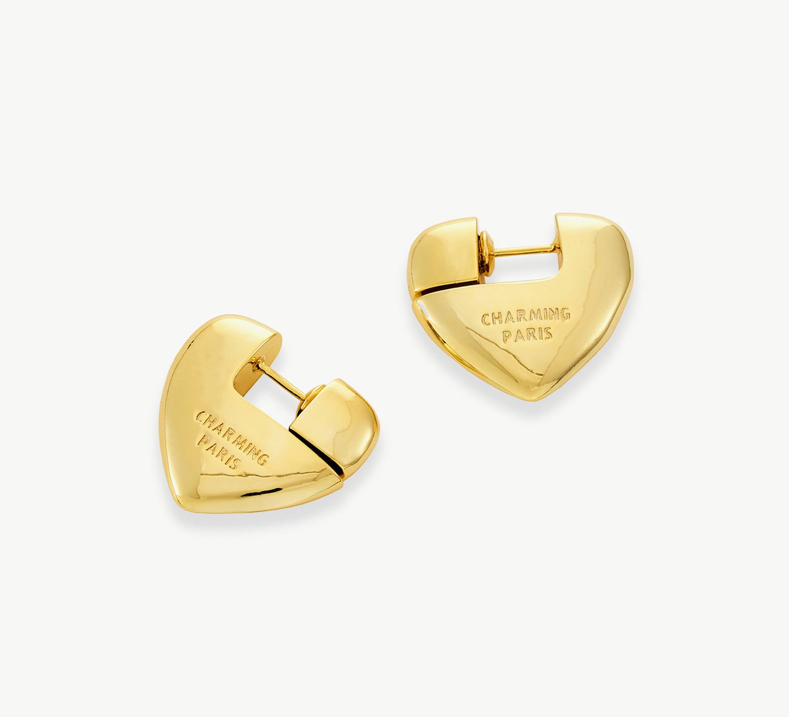 Gold Heart Hoop Earrings, glistening with gilded charm, these hoops add a romantic and fashionable element to your ensemble