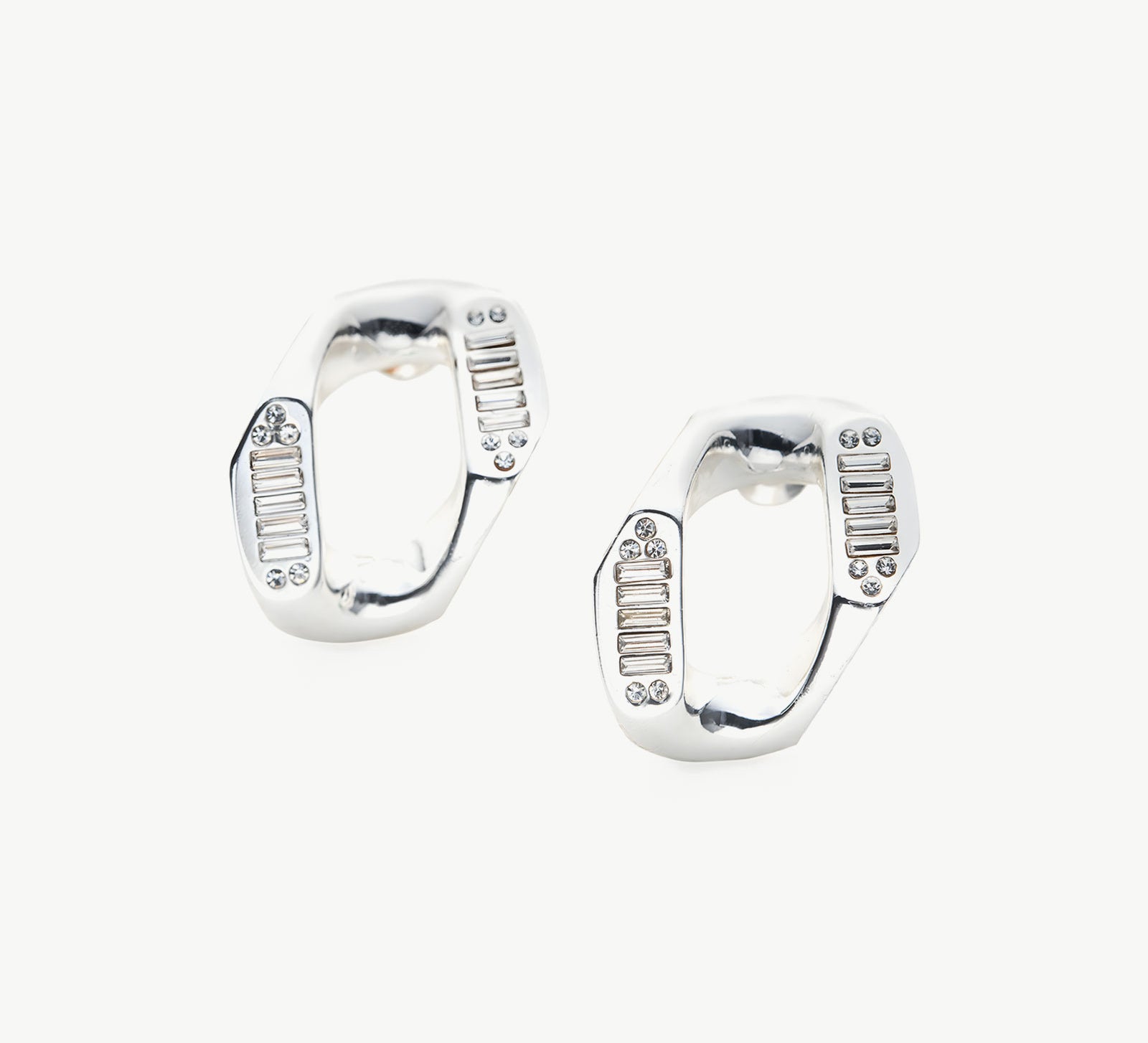 Contemporary Silver Charm: Crystal-adorned Wavy Stud Earrings in silver, a contemporary and stylish choice that complements your look with understated elegance