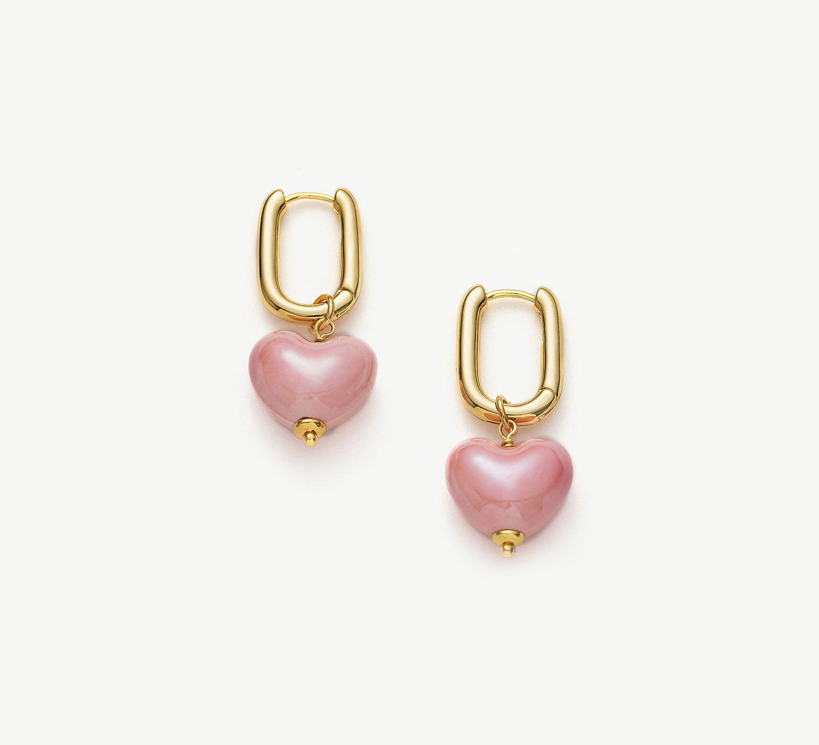 Ceramics Heart Hoop Earrings in Pink, a romantic and blush-toned accessory that adds a touch of love and charm to your ear ensemble.