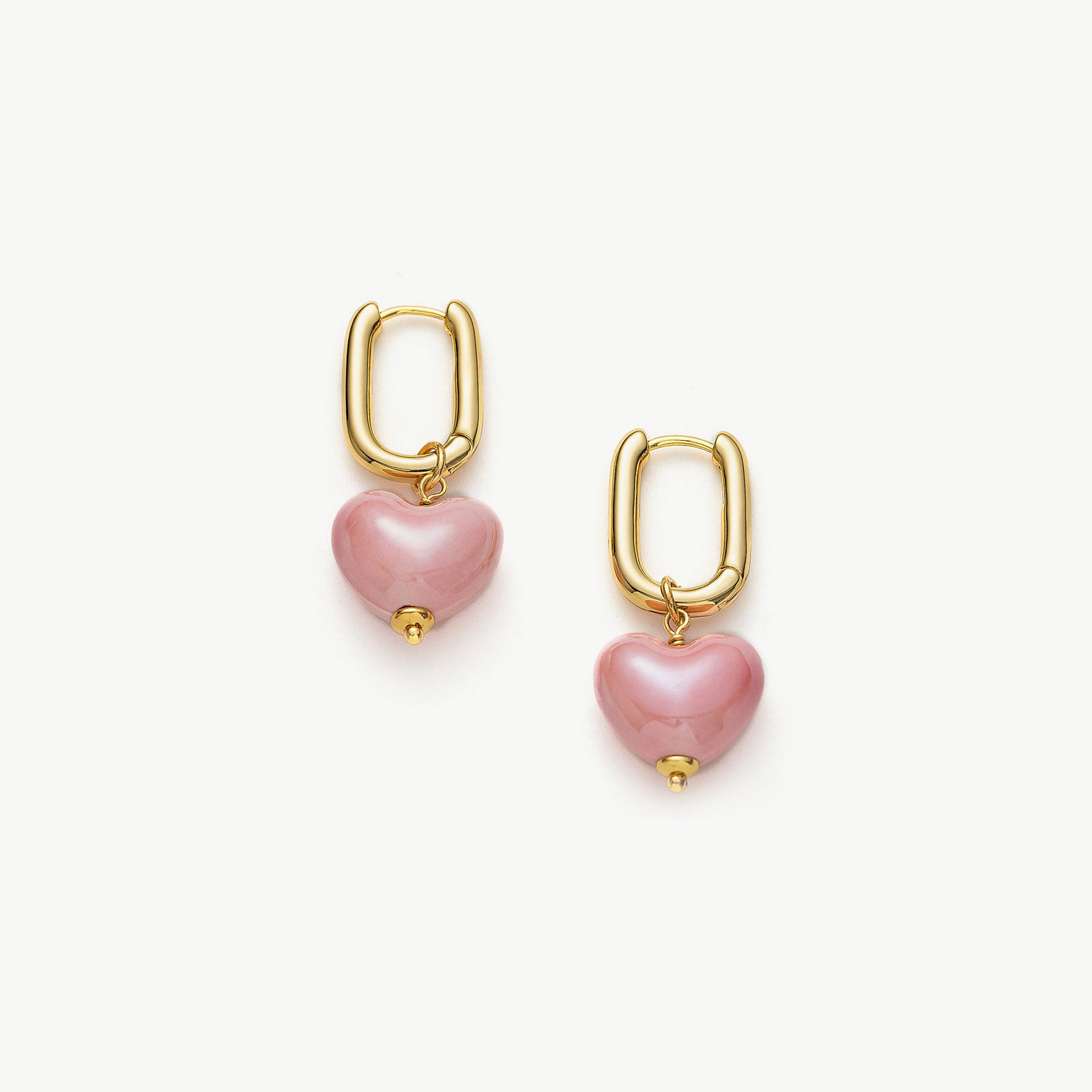 Ceramics Heart Hoop Earrings in Pink, a romantic and blush-toned accessory that adds a touch of love and charm to your ear ensemble.