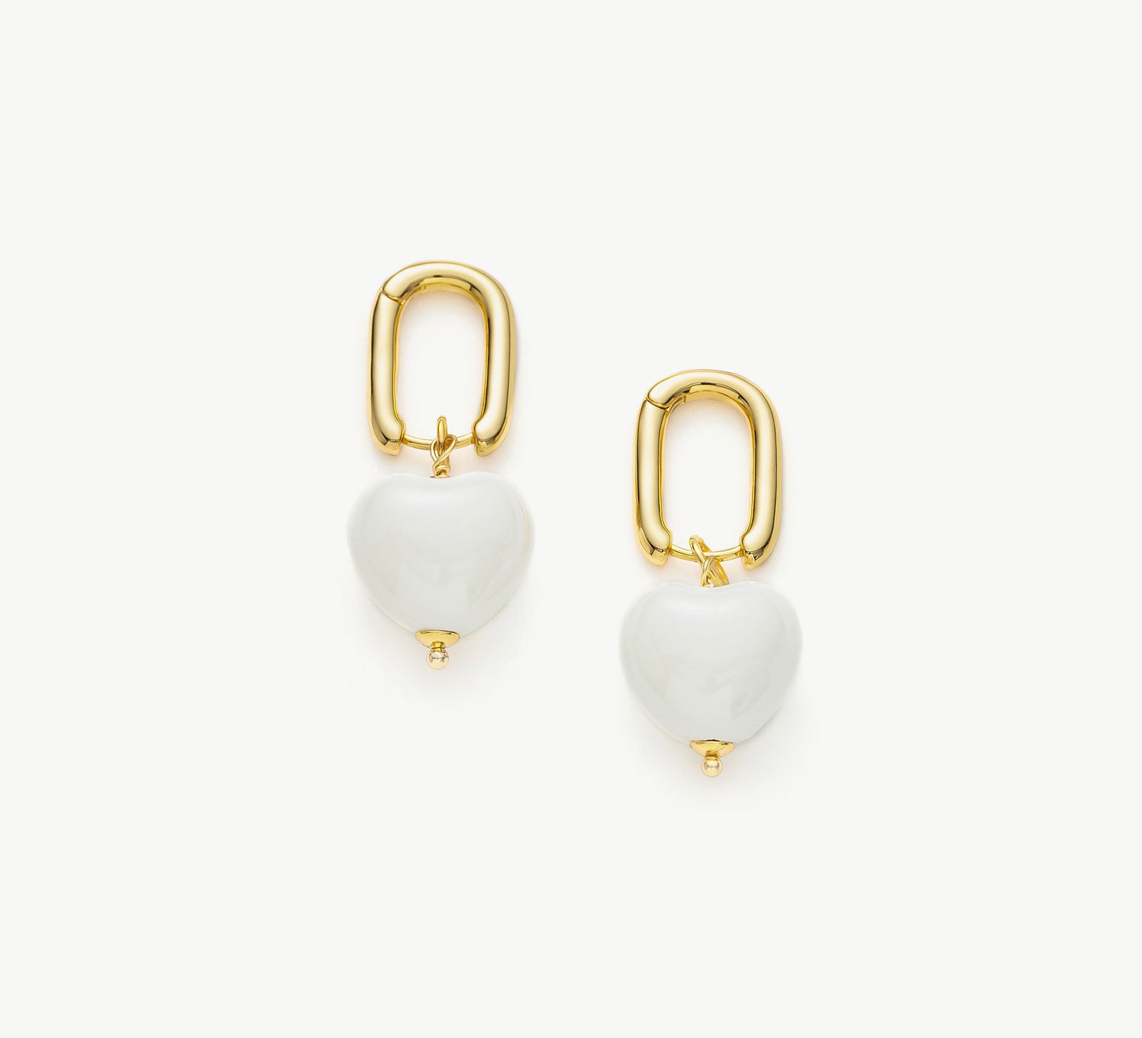  Ceramics Heart Hoop Earrings in White, an elegant and pure accessory featuring heart-shaped hoops in a pristine and timeless white hue