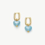  Ceramics Heart Hoop Earrings in Blue, a charming and ceramic accessory that features heart-shaped hoops in a serene and captivating cerulean blue hue
