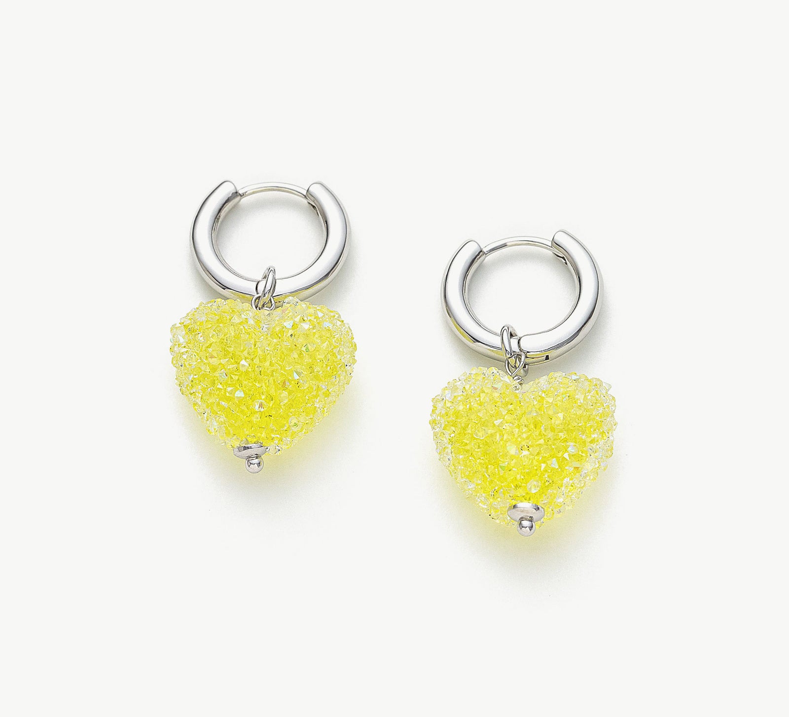 Shining Heart Hoop Earrings in Yellow, radiating with the warmth of sunlit charm, these hoops feature heart shapes in a delightful shade of yellow for a vibrant and luminous look