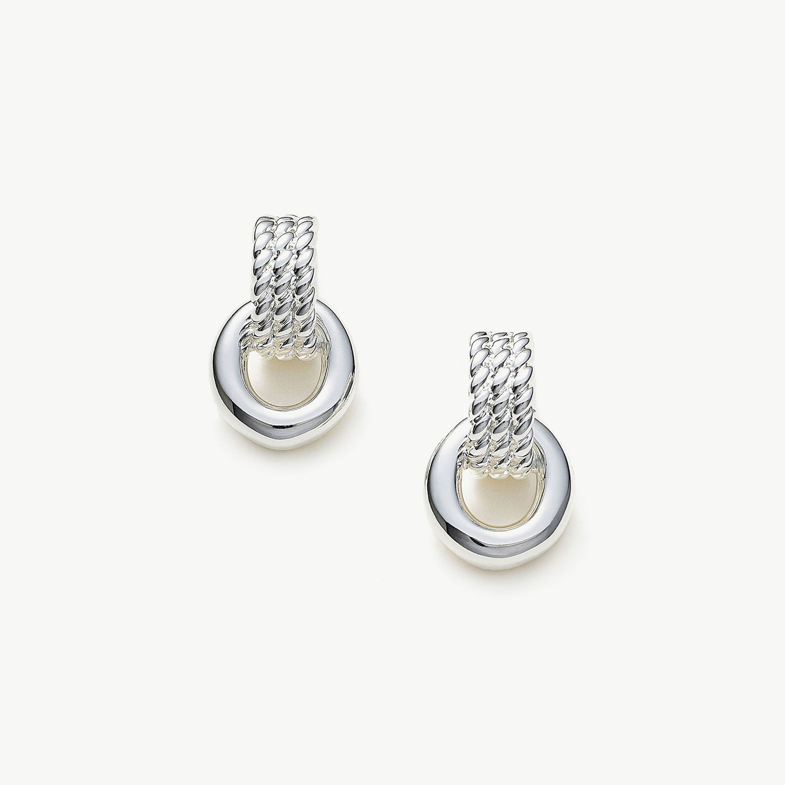  Ring Entwine Chunky Earrings in Silver, showcasing a sleek and shiny design, these earrings add a touch of modern sophistication to your ear ensemble