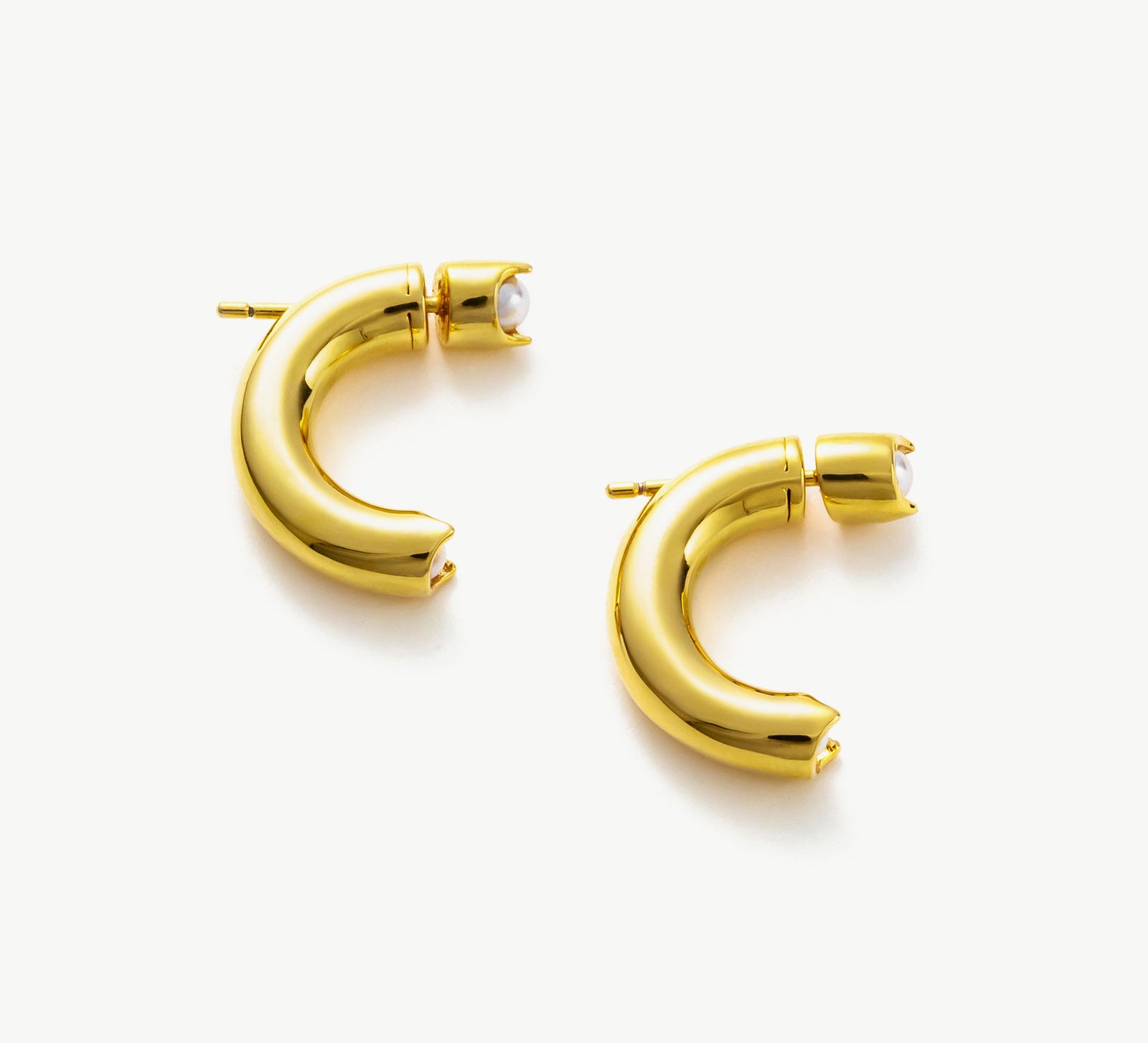 Mini Hoop Earrings in Gold, a radiant and dainty accessory that adds a touch of warmth and sophistication to your ear ensemble